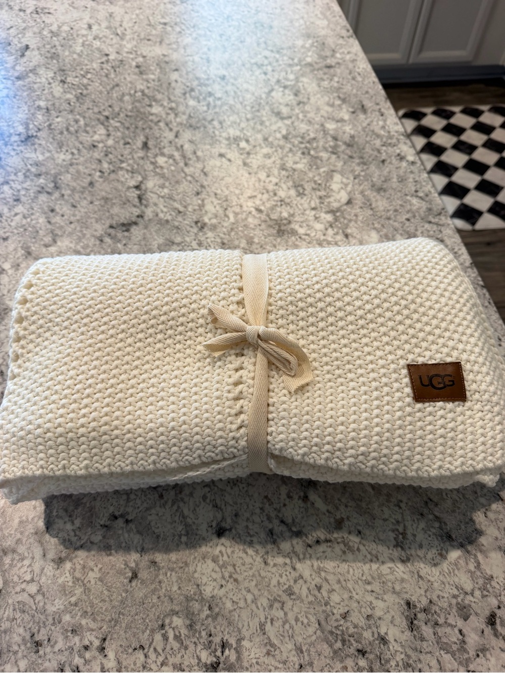 UGG Cream Knit Throw with Leather Logo